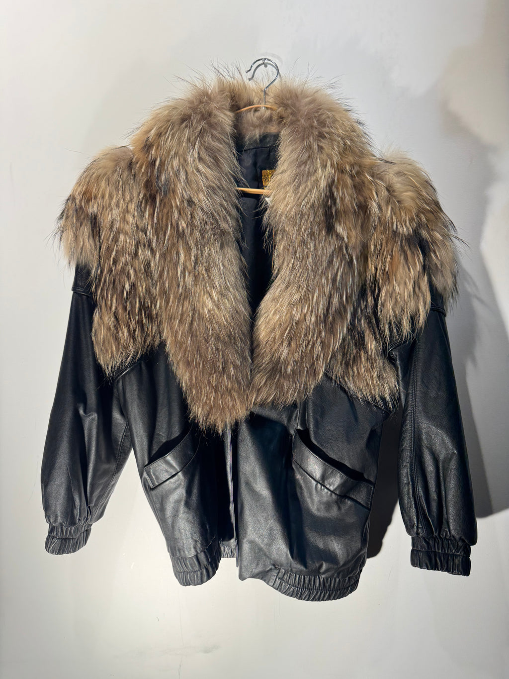 Vintage Black Leather Bomber Jacket with Raccoon Fur Collar