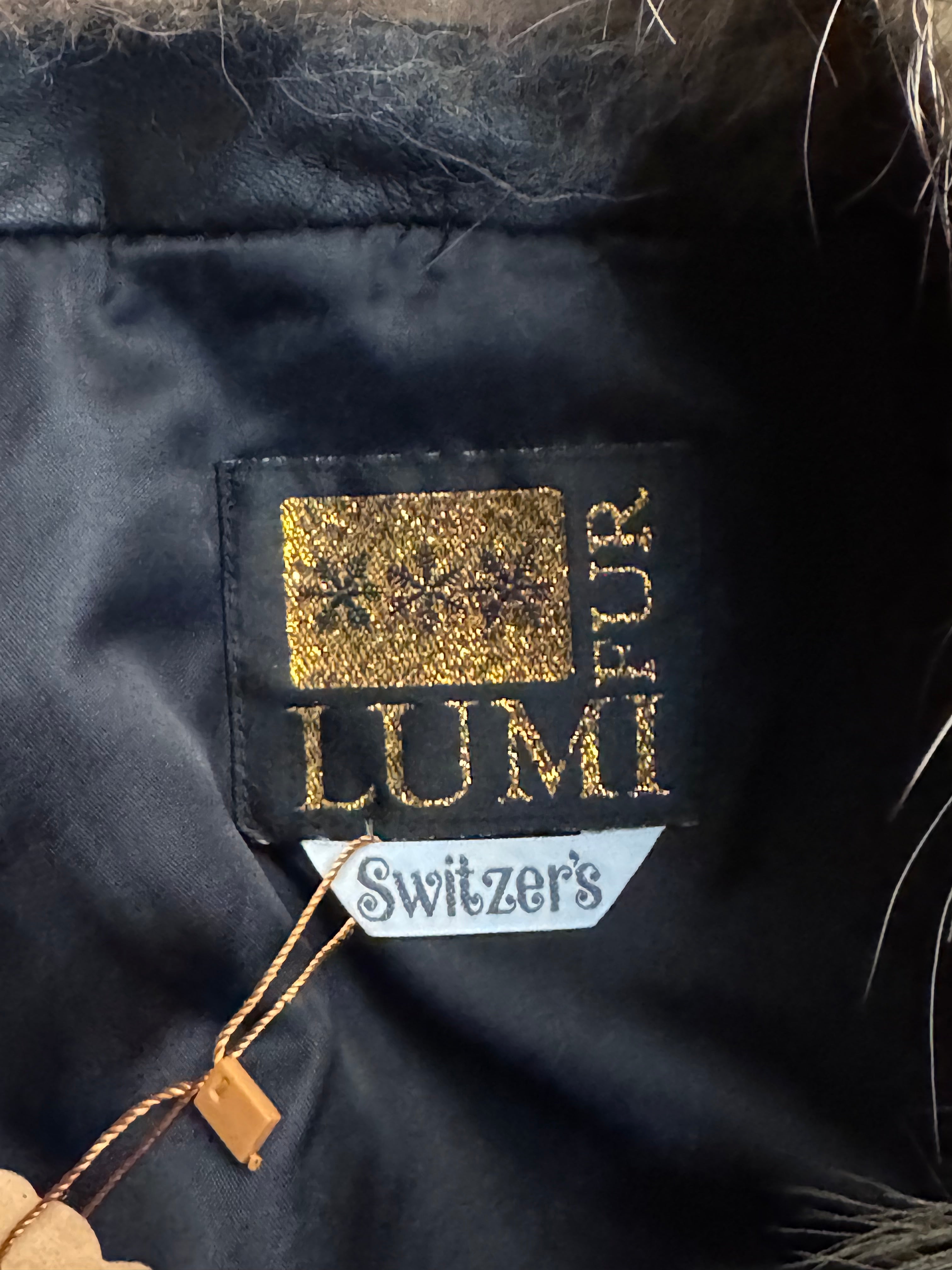 Vintage Black Leather Bomber Jacket with Raccoon Fur Collar